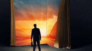 Silhoutte of a man standing in front of a book with a sunrise inside